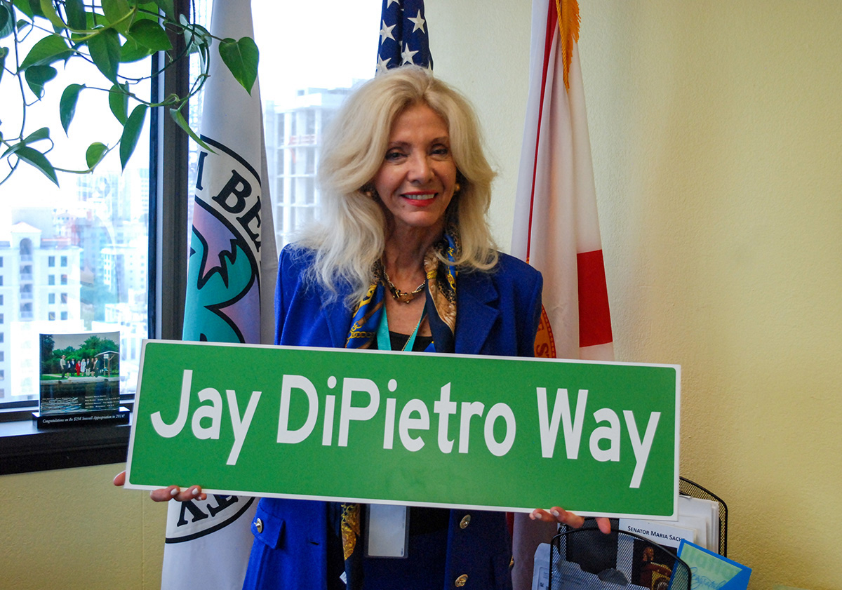 Commissioner Sachs with Jay DiPietro road sign